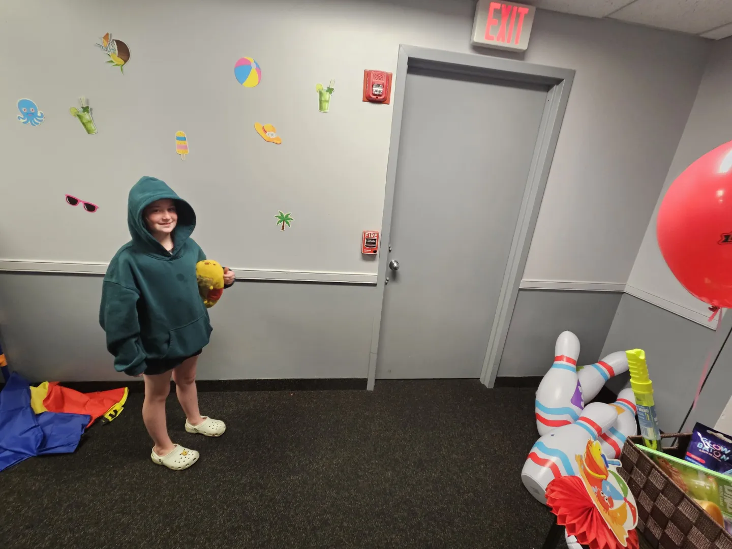 A Dental Care Kids patient in the play area during a happy visit