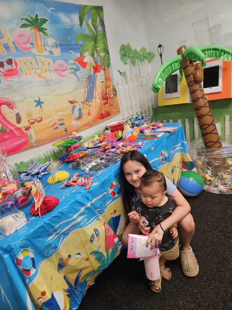 Friendly pediatric dental interaction showing patience and guidance