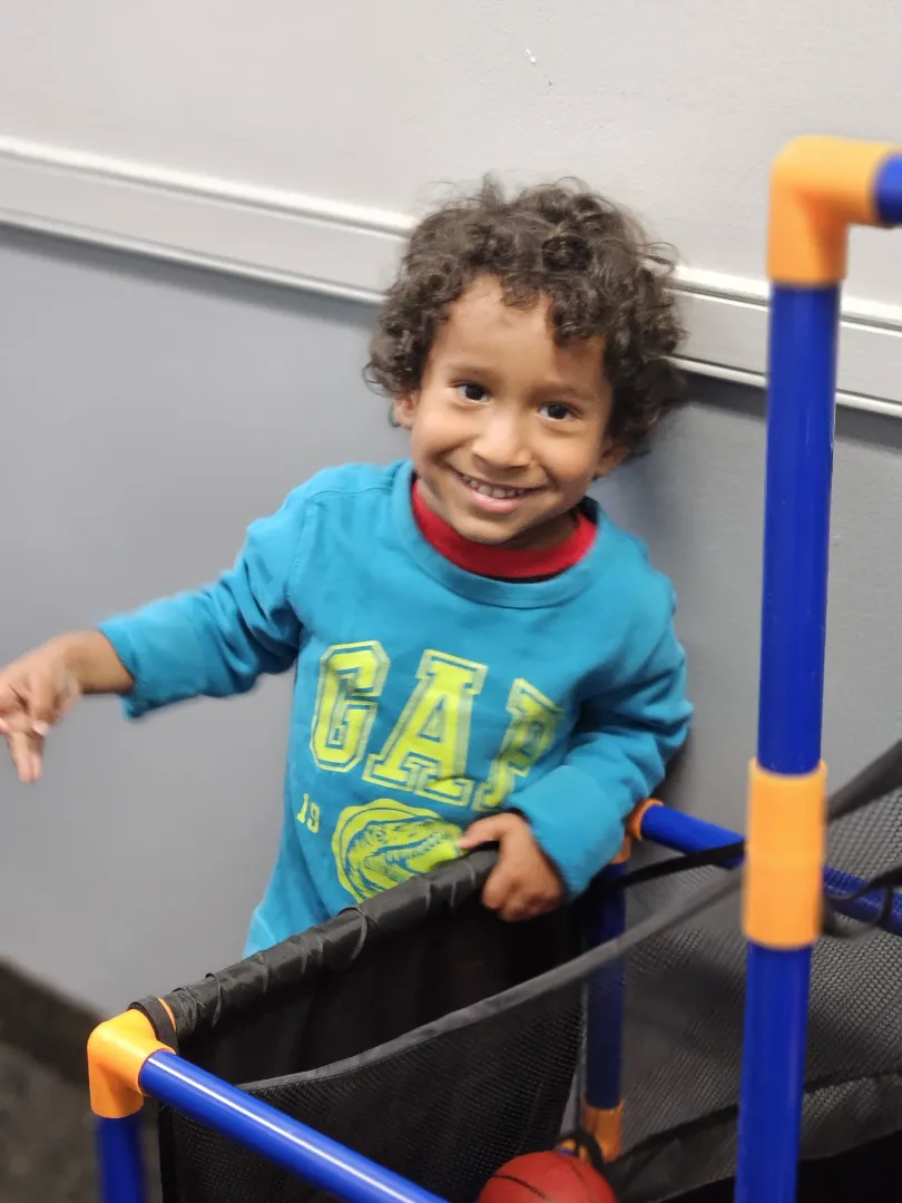 A smiling Dental Care Kids patient in the play area