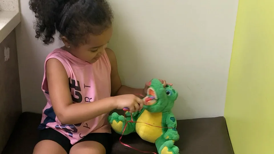 Young patient playing in a Dental Care Kids operatory